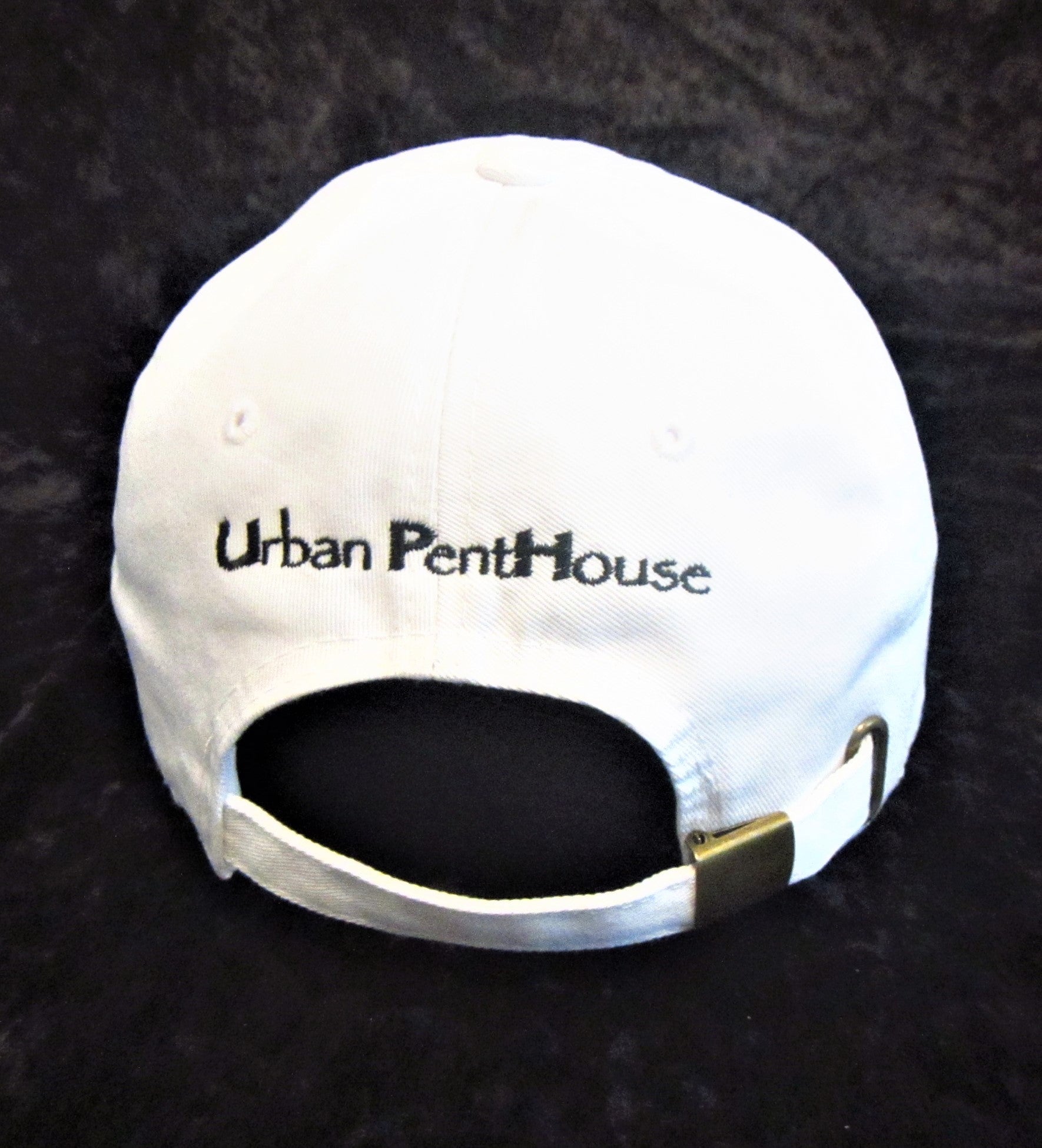 Back white baseball cap with Urban PentHouse embroidery in black and adjustable buckle.
