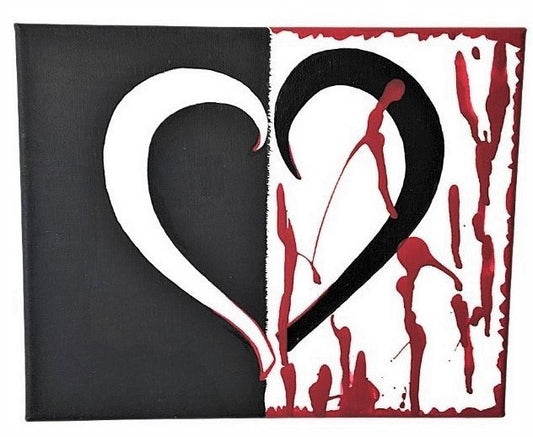 Front view of a centered bleeding  heart split in two with contrasting black and white, red abstract splatter on the right side.