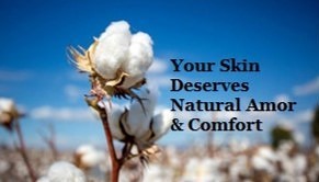 Field of natural cotton plants with bright blue sky background.
