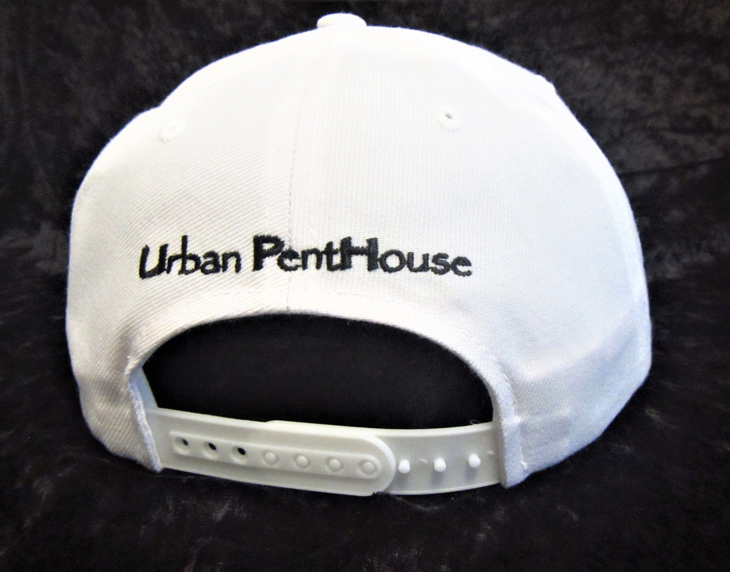 Back of White Flat Brim cap with Urban PentHouse embroidery in black with adjustable snapback closure.