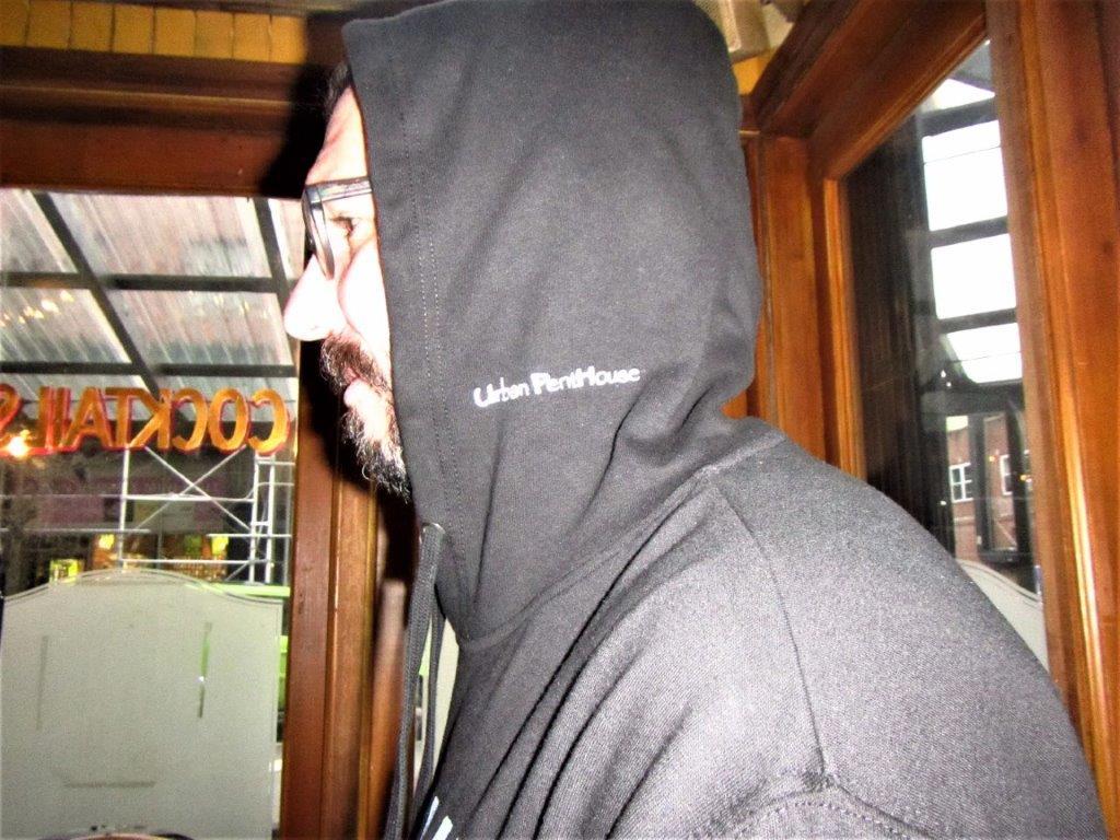 Side view of Urban PentHouse white embroidery on hood.