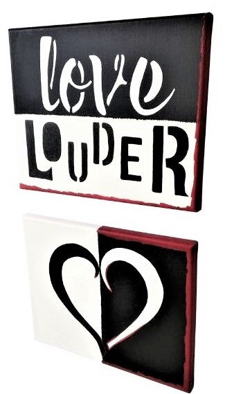 Left facing Solid love canvas set, hand painted Love Louder in white and black, the other showing a heart shape in bold white and black, red accent borders.